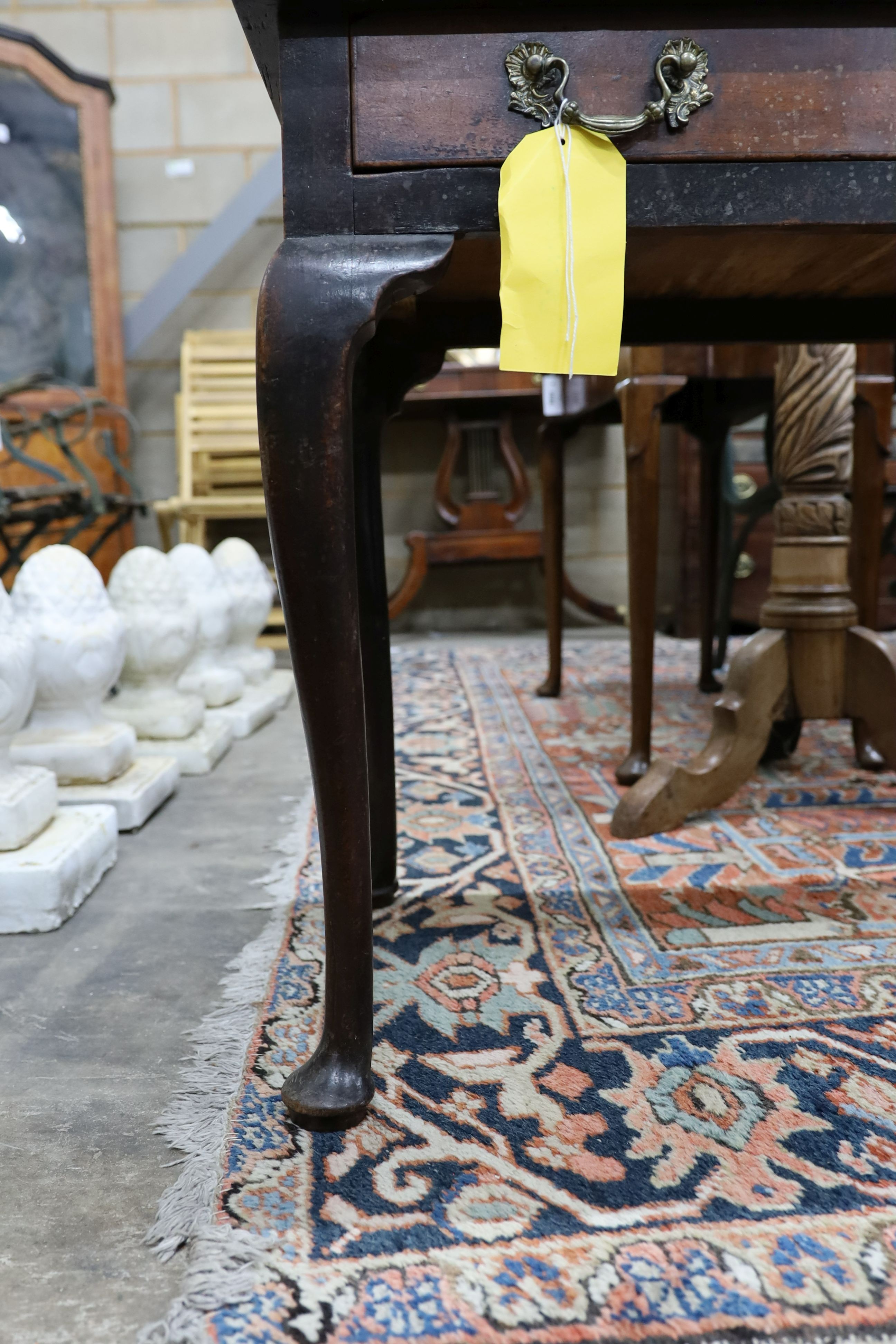 A George III mahogany side table, fitted with a single drawer, on cabriole legs, width 83cm, depth 48cm, height 67cm